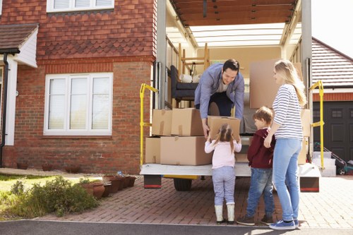 Professional house removalists loading boxes in Tooting