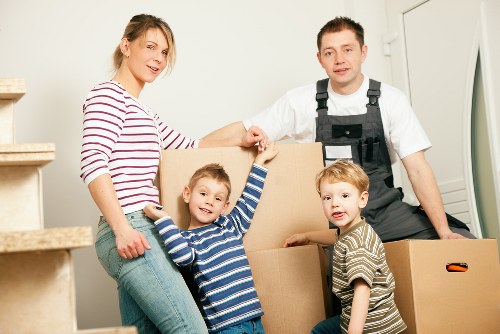 Urgent same day removals team loading boxes in Tooting
