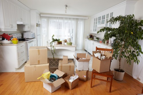 IT equipment and office furniture being packed for a business move