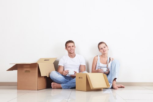 Professional movers carrying furniture during a Tooting house relocation