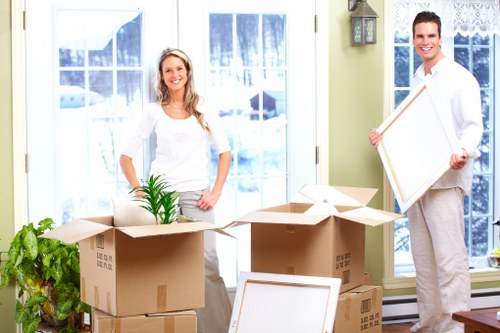 Local commercial movers transporting office equipment in Tooting