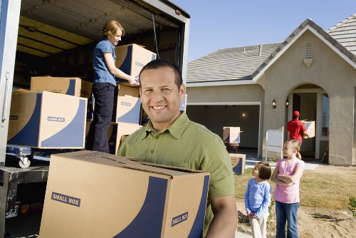 Local packing team organizing household items in Tooting