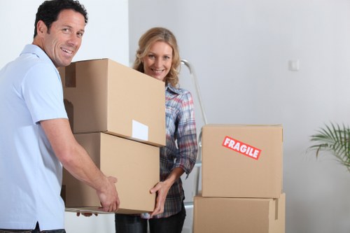Professional movers handling furniture during a Tooting same day move